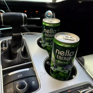 Two Nello Energy cans in a car cupholder