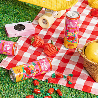 Strawberry Lemon Nello Energy cans on a picnic blanket
