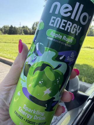 Nello Energy can in a hand outside