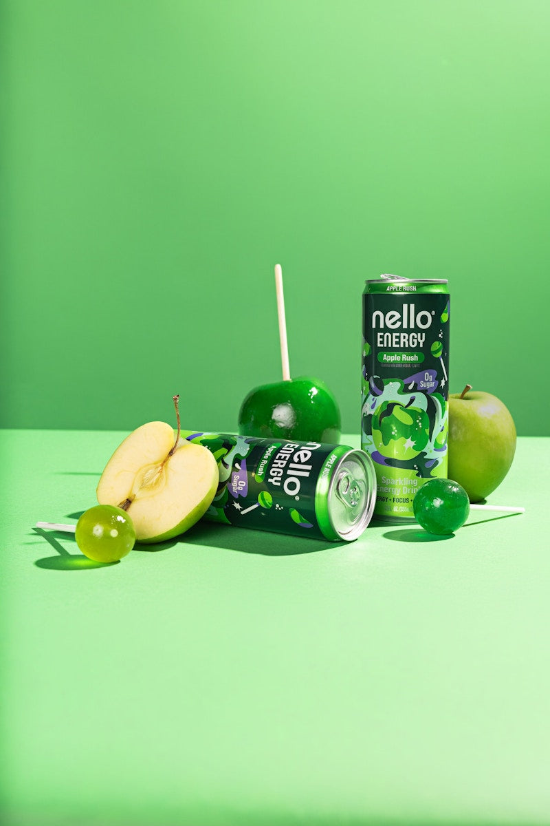 Two Nello Energy Apple Rush cans with green apples