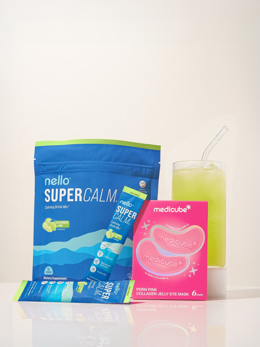 Nello Supercalm Cucumber Lime, a stick pack, the medicube jelly eye mask box and a glass of Supercalm