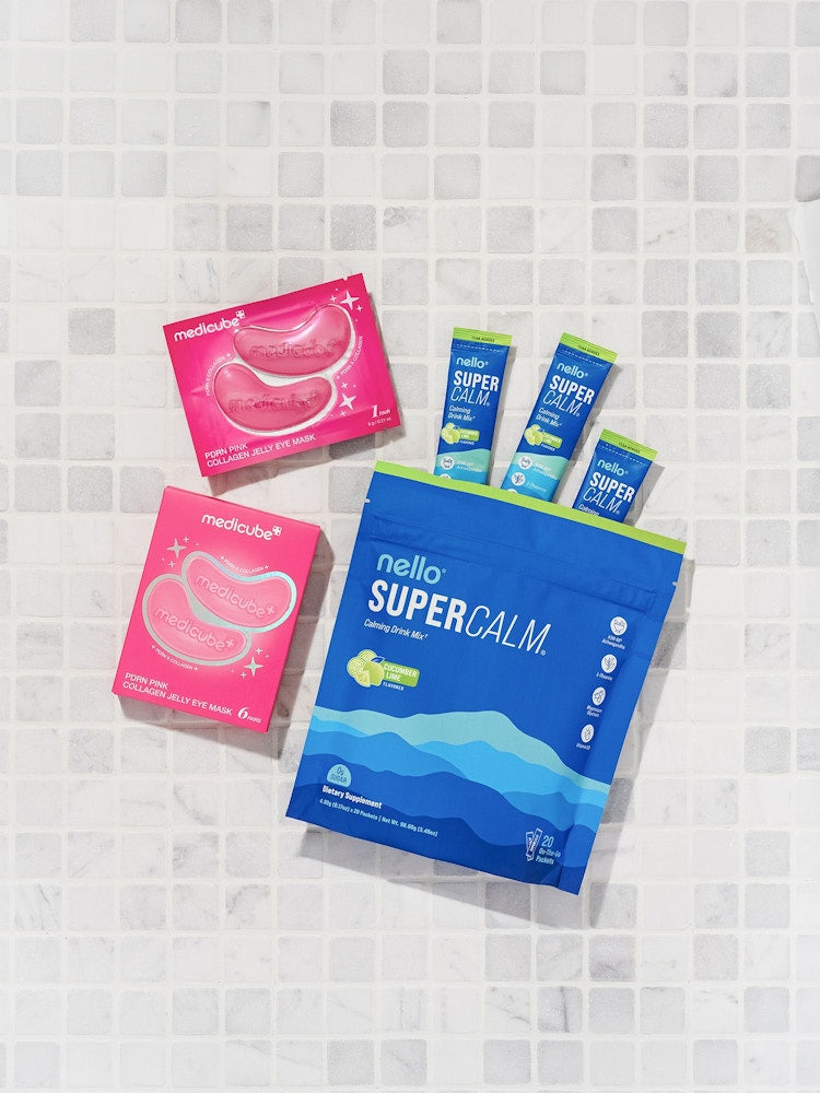 Nello Supercalm with medicube jelly eye masks laid out on white tile