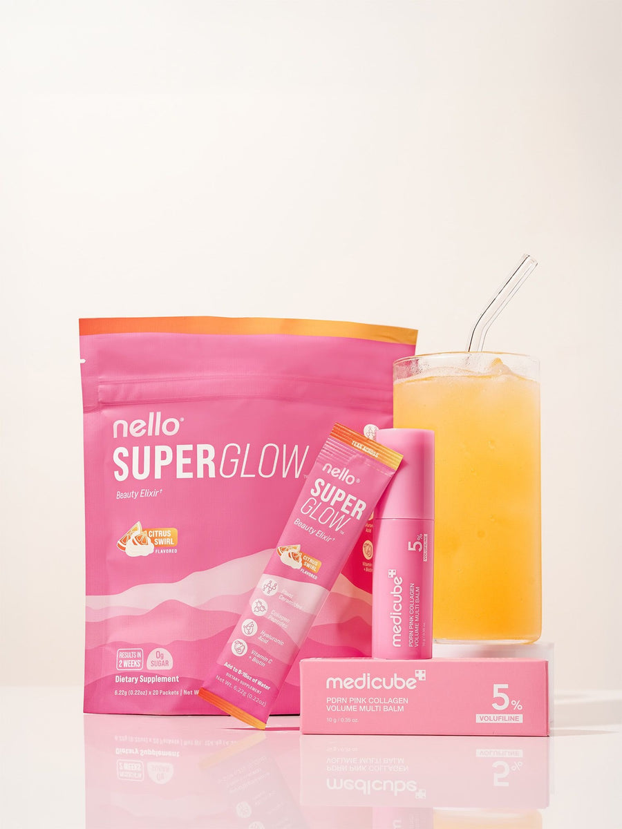 Nello Superglow Citrus Swirl, a stick pack, the medicube PDRN Multi Balm and a glass of Superglow